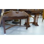 Small furniture: to include a nesting set of four mahogany side tables, each raised on spindle