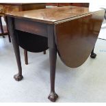 A George III mahogany drop leaf dining table, raised on turned legs, talon and ball feet  28"h  42"w