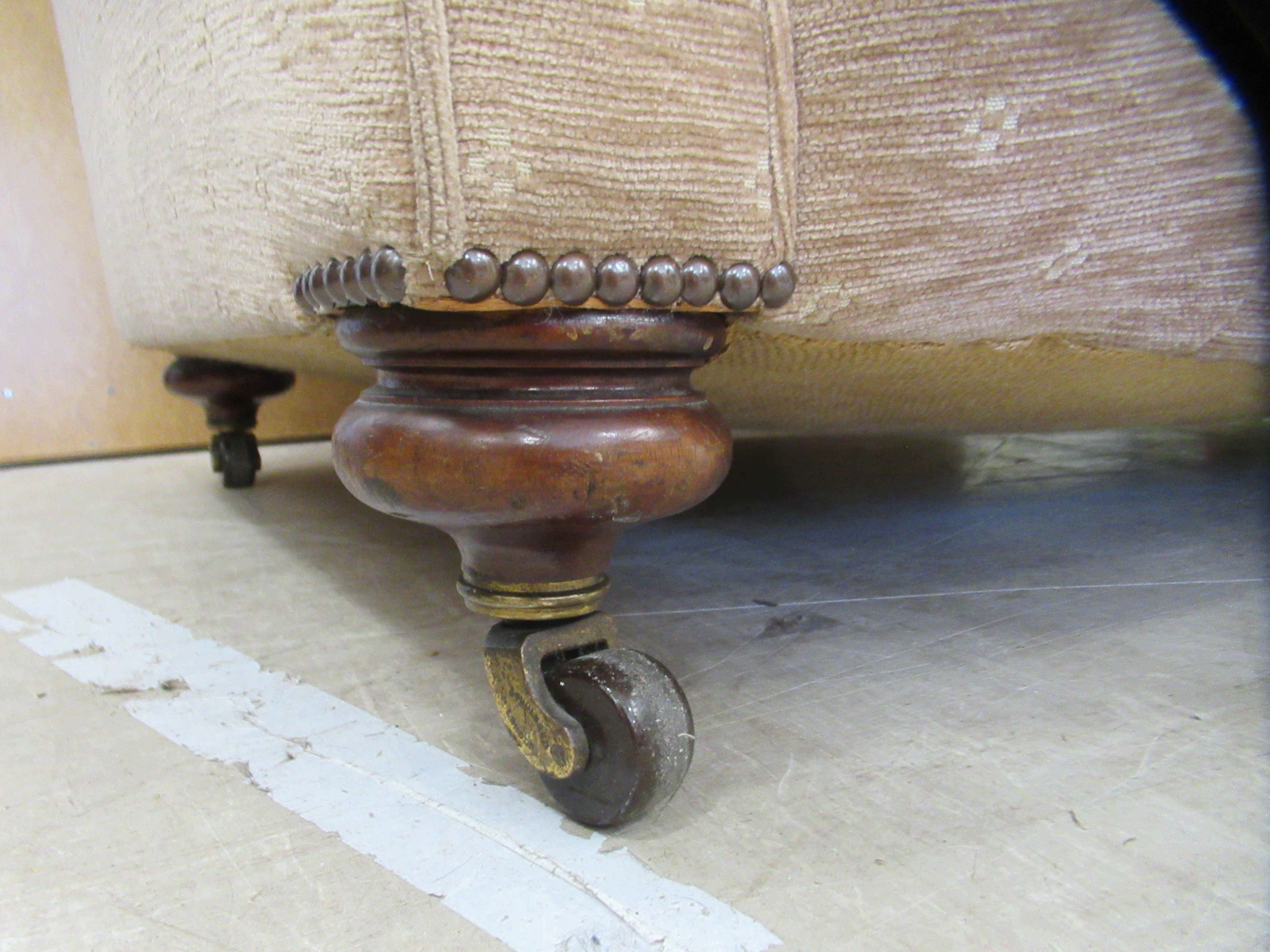 An early 20thC and later upholstered Chesterfield, raised on turned forelegs and casters  74"w - Image 4 of 5