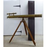 A World War II period lacquered brass telescope with sight, on a tripod base and wooden fitted case