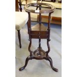 A late George III mahogany washstand, raised on a splayed tripod base  31"h