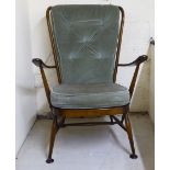 An Ercol dark stained beech and elm framed high hoop and spindle back open armchair with green