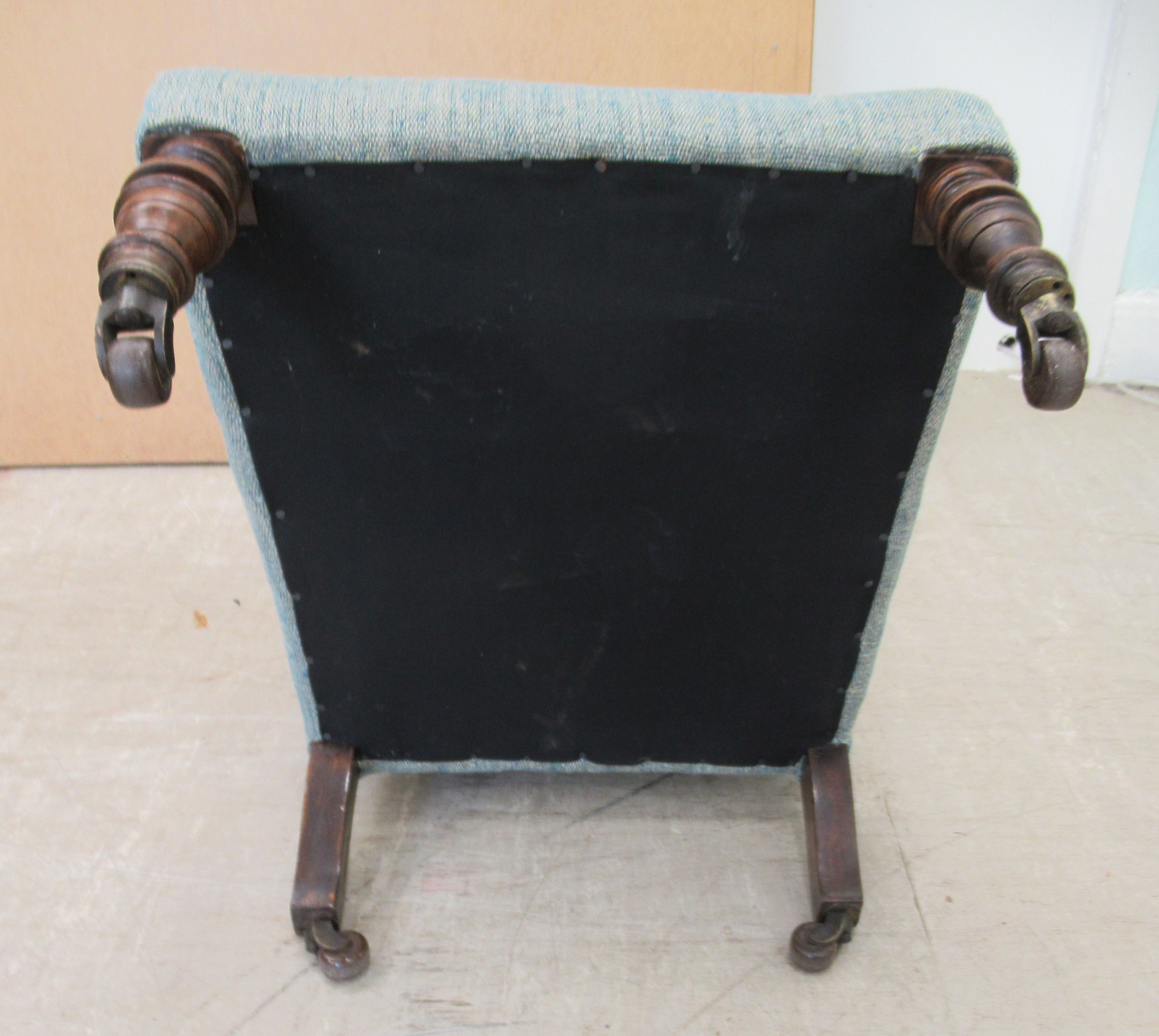 An Edwardian nursing chair, later upholstered in multi-coloured fabric, raised on turned forelegs - Image 5 of 5