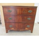 A late 19thC crossbanded mahogany three drawer dressing chest, raised on bracket feet  33"h  35"w