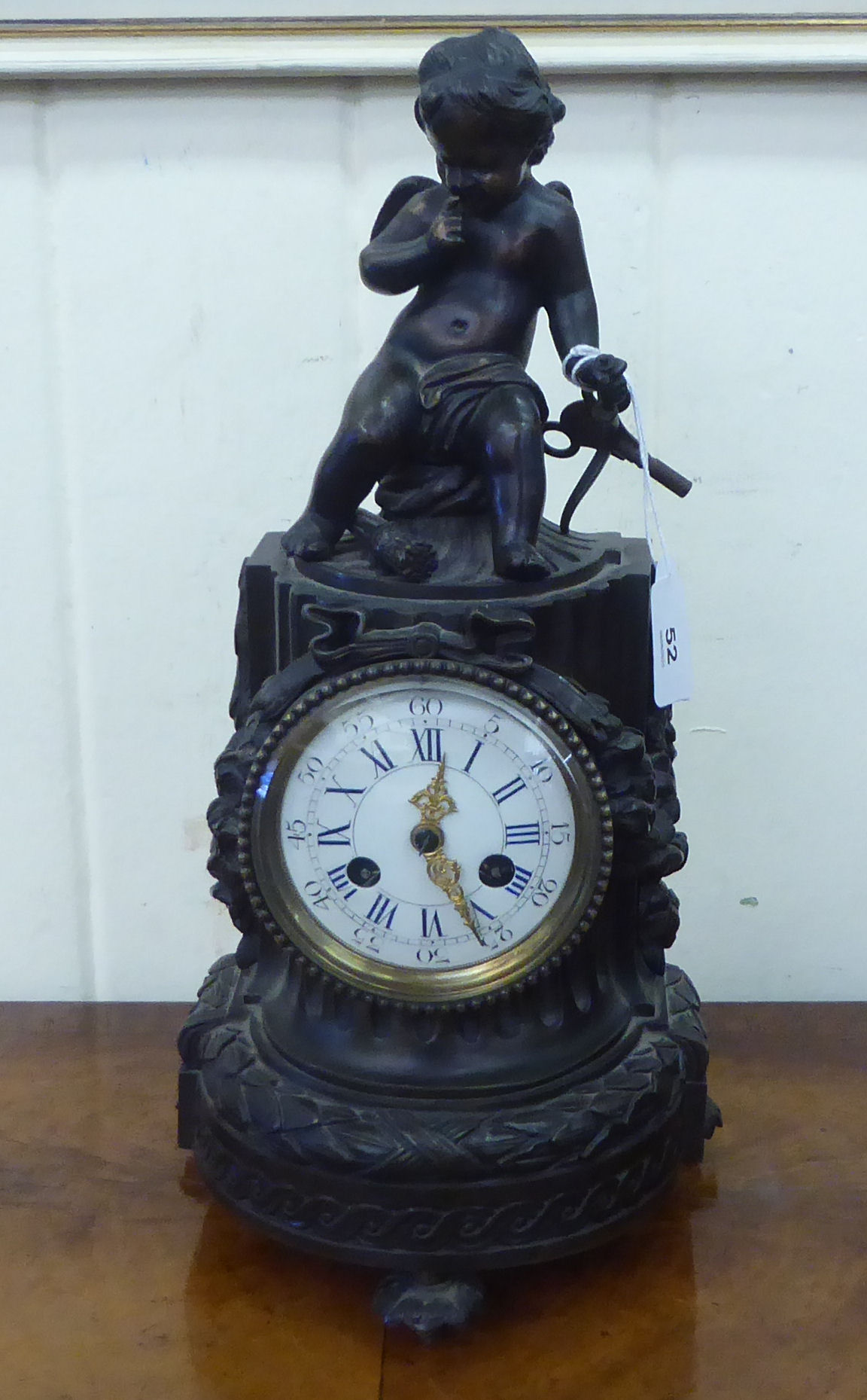 A reproduction of a 19thC French bronzed finished mantel clock; faced by a Roman dial  14"h