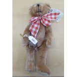 A Merrythought Toffee Apple Teddy bear, in brown plush with mobile limbs  13"h