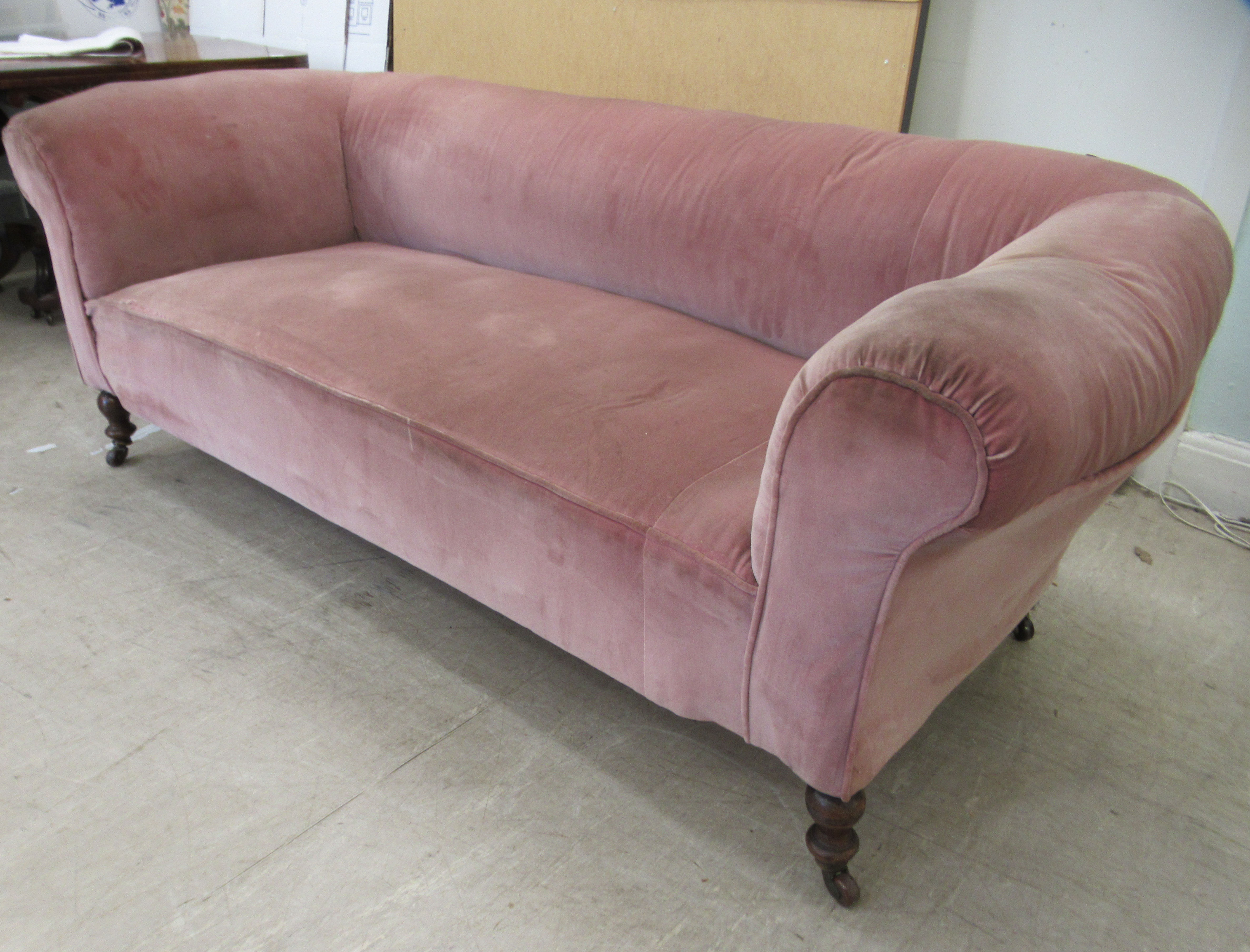 An Edwardian and later upholstered Chesterfield, raised on ring turned forelegs and casters  74"w, - Image 3 of 4