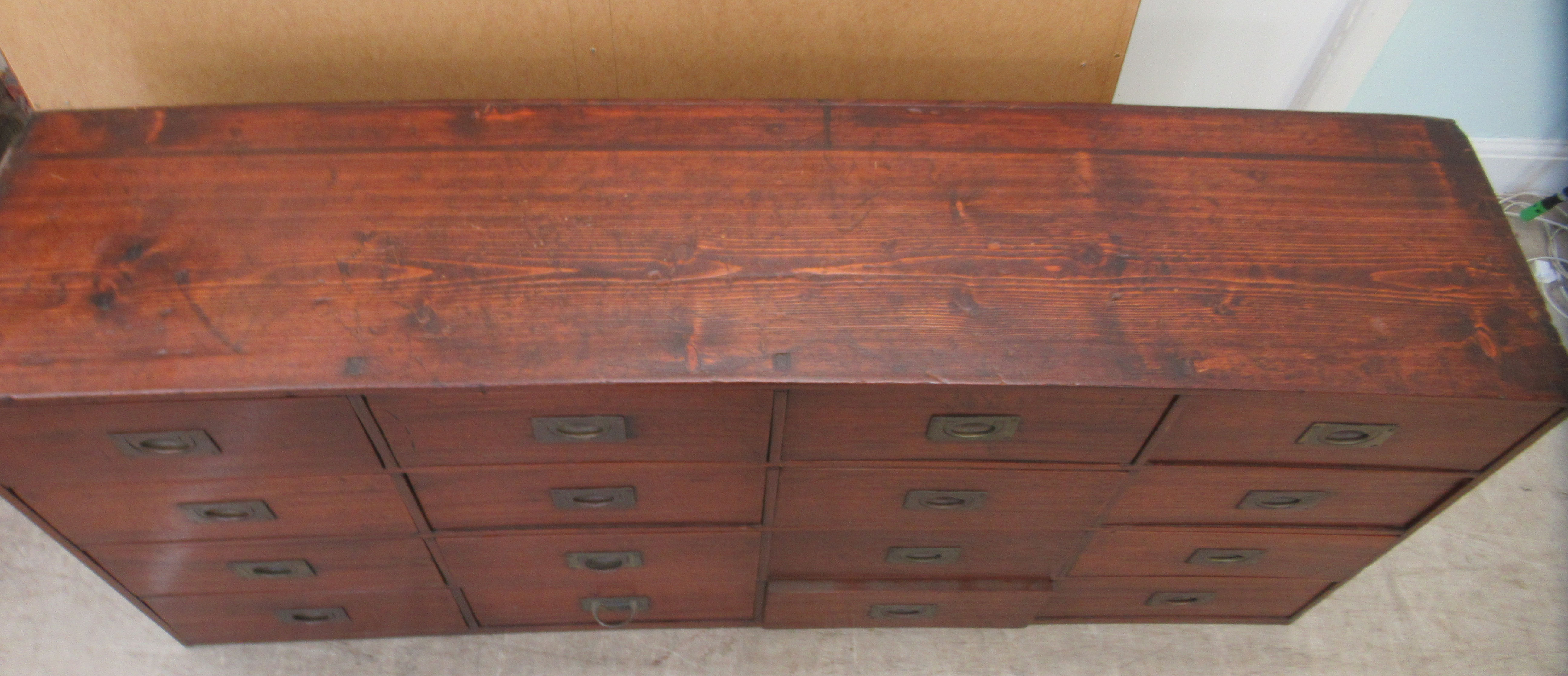 An early 20thC Chinese stained pine sixteen drawer cabinet, on a plinth  30"h  63"w - Image 5 of 5