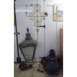 Architectural salvage type items: to include a lantern (head only) 44"h; and a pair of cast iron