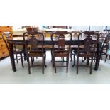 A modern Chinese mahogany dining table, raised on square legs and spade feet  30"h  60"dia with