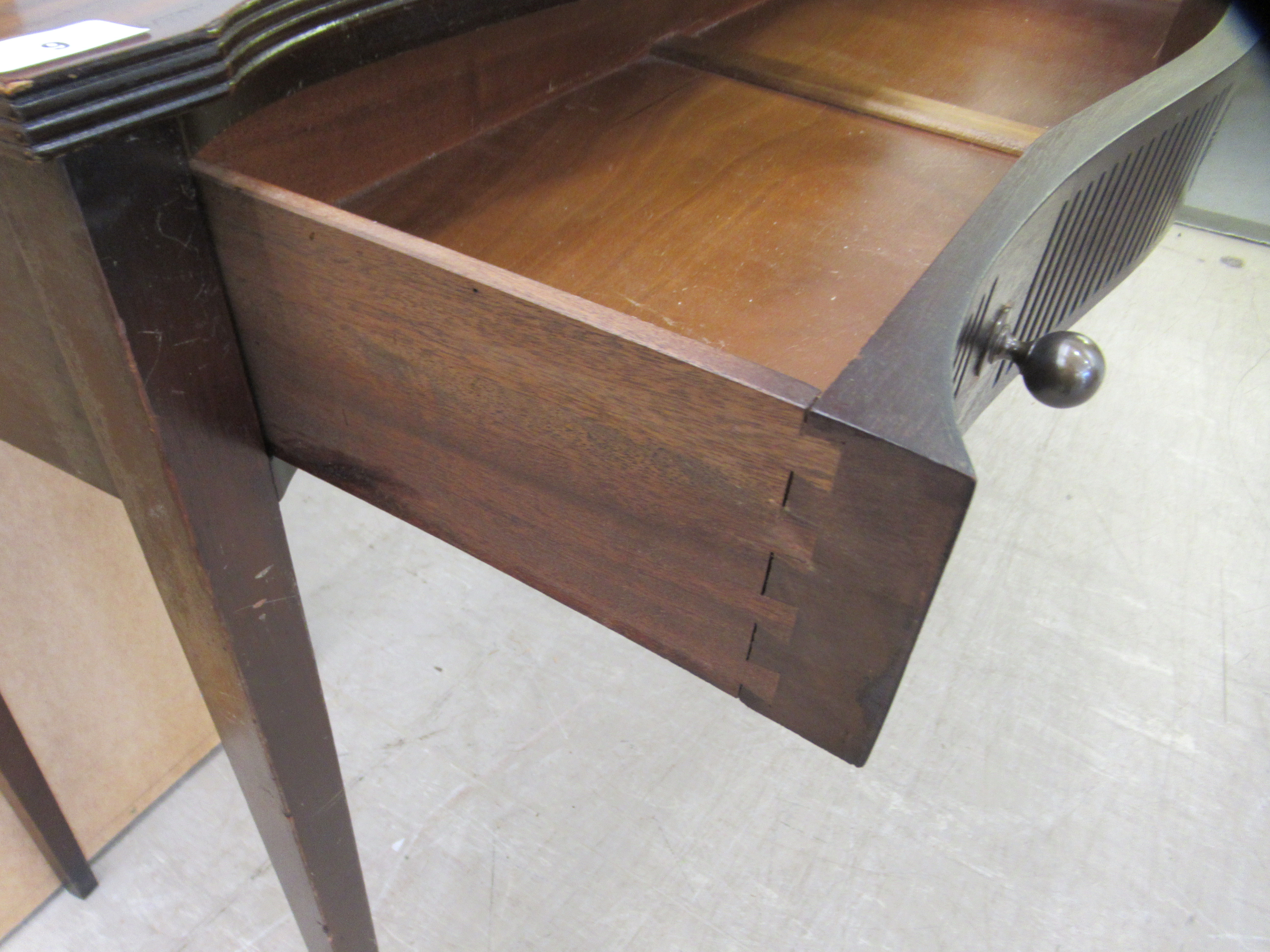 An early 20thC mahogany veneered serpentine front single drawer side table, raised on square, - Image 5 of 5