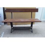An early 20thC cast iron and planked pine framed two person terrace bench  48"w