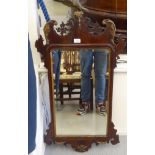 A Georgian mirror, in a fretworked mahogany frame with Ho-Ho bird ornament  41" x 21"