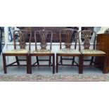 A set of four George III mahogany framed, pierced splat back chairs, the tapestry upholstered drop-