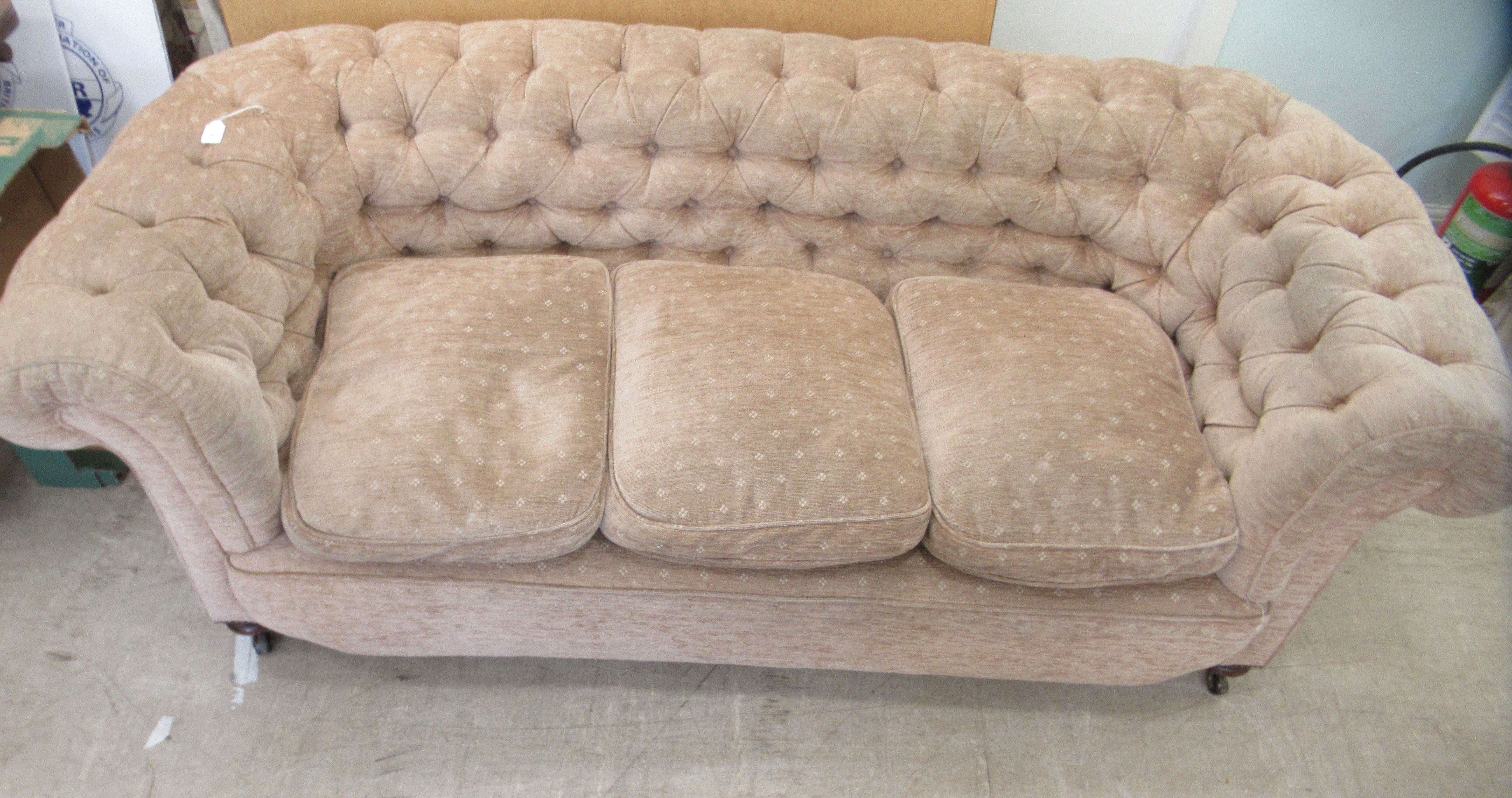 An early 20thC and later upholstered Chesterfield, raised on turned forelegs and casters  74"w - Image 2 of 5