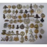 Approx. fifty military cap badges and other insignia, some copies: to include Artist's Rifles; The