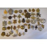 Approx. forty military regimental cap badges and other insignia, some copies: to include Royal