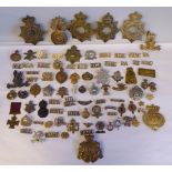 A collection of military cap badges, uniform titles and other insignia, some copies: to include