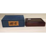 A modern Chinese rosewood box and cover of shallow, rectangular form, decorated with two relief