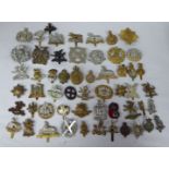 Approx. fifty military cap badges and other insignia, some copies: to include UTP; Women's Transport