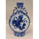 A Chinese late Qinglong porcelain moonflask, decorated in blue and white, a dragon and a mythical