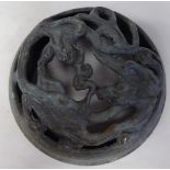 A Chinese cast bronze cover, decorated with dragons  4"dia