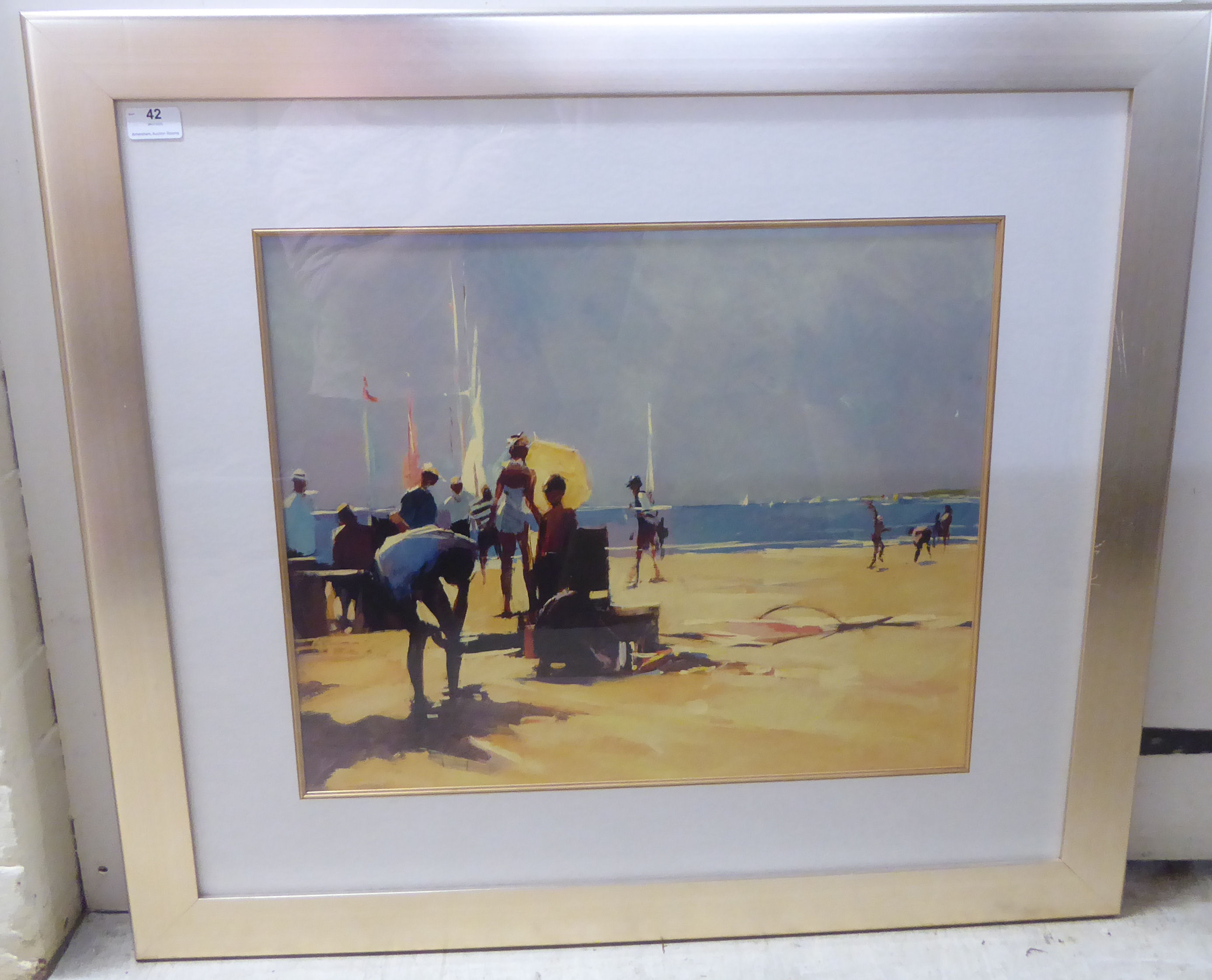 A study of figures on a beach  coloured print  17" x 38"  framed