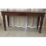 A William IV mahogany serving table, the top having provision for a low curtain rail, over one