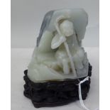A Chinese white jade Luohan seated figure with a crook  4"h on a profusely carved Zitan stand