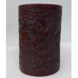 A Chinese carved and stained bamboo brush pot, featuring various mythical figures  6"h