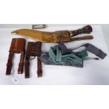 Military related items: to include webbing belts; two similar kukri belt hangers; and a kukri with a