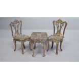 A silver miniature French style table and two chairs  A&W  London 1976