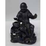 A 19thC Chinese cast metal figure, a seated immortal