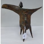 A Chinese (reduced) reproduction of a 12thC BC cast bronze wine carrier, elevated on three spiked