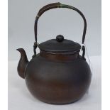 A Chinese copper finished bulbous teapot with a stubby spout, lid and folding top handle