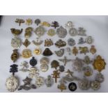 Approx. fifty military cap badges and other insignia, some copies: to include Glider Pilot Regiment;