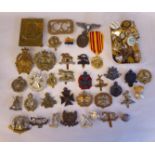 A miscellany of mainly British military badges and other emblems, some on cloth (Please Note: this