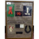 A display of Great War Welsh military cloth flashes  14" x 10"  framed (Please Note: this lot is