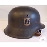 A World War II German SS steel helmet with one decal, a hide liner and chinstrap, indistinctly