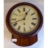 A late 19thC walnut cased wall timepiece, in a turned surround; the movement faced by a painted