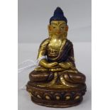 An Asian cast and parcel gilt bronze figure, a seated Buddha, on a lotus flower  3"h