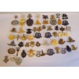 Approx. fifty military cap badges and other insignia, some copies: to include King's Own Malta