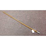 A military swagger stick, the white metal cap terminal bearing the Royal Monmouthshire emblem (