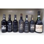 A bottle of Delamain Cognac; and six bottles of port: to include a 1960's Dow's