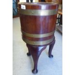A George III mahogany brass banded wine cooler, on a matched stand  23"h  12"dia