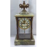 An early 20thC onyx and brass framed, four glass mantel timepiece; the movement faced by a Roman