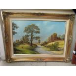 Arthur Read - a winding road in an open landscape with hills beyond  oil on canvas  bears a