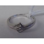 A 9ct white gold ring set with eight diamonds