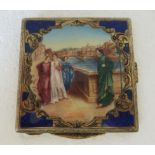 An engraved square, silver gilt coloured metal powder compact, featuring figures in a Venetian scene