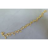 A Chinese high grade gold bead and hoop link bracelet